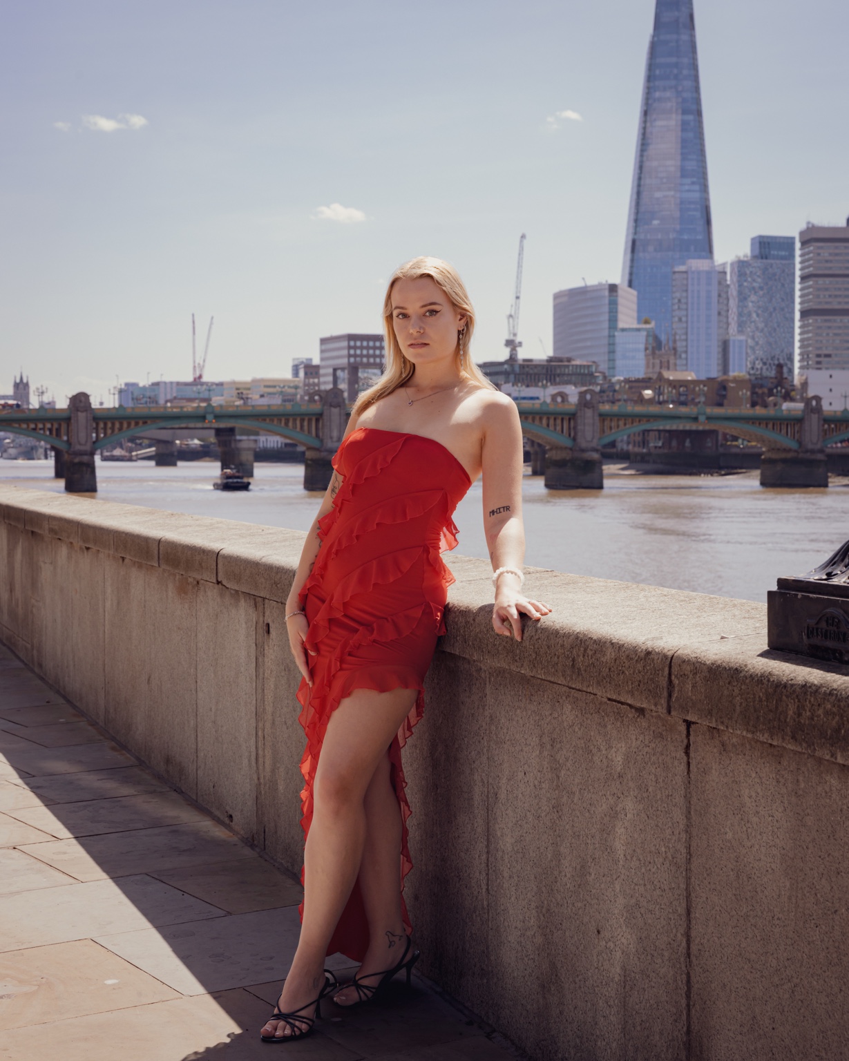Full length fashion portrait of Niamh in a red dress